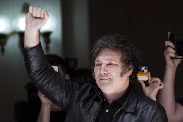 Man with Ukrainian flag. What should Ukraine expect from Argentina’s newly elected president?